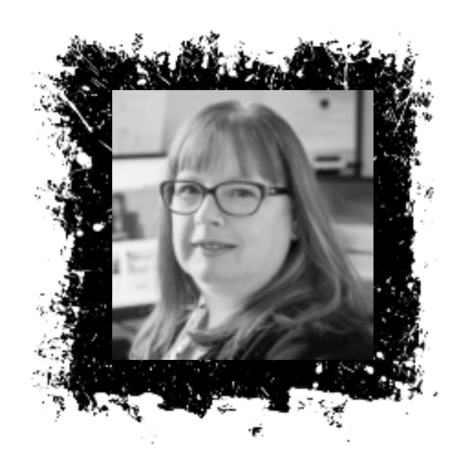 Woman with glasses smiles in a black and white photo within a textured black square border.
