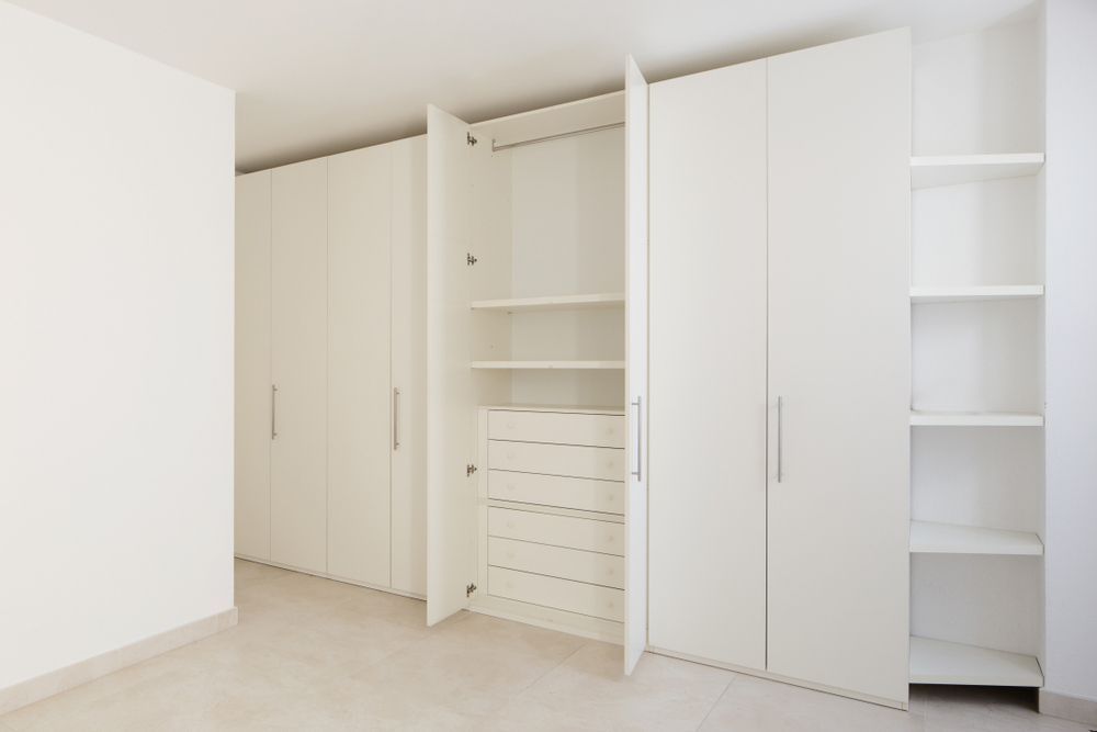 An Empty Room with White Cabinets and Shelves — Rodney Lees Cabinetmaking In Alstonville, NSW