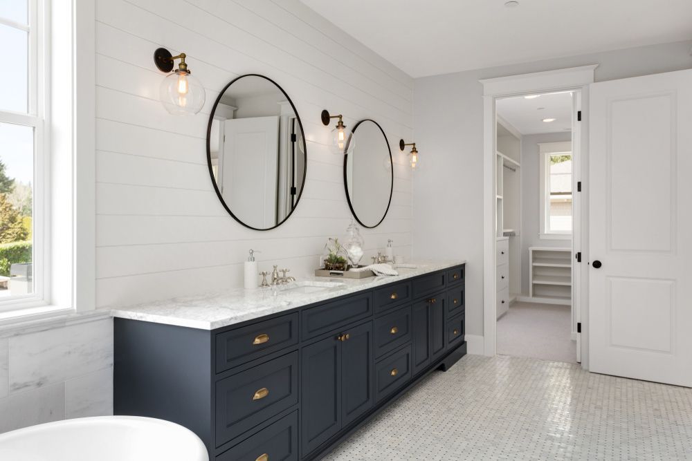 A Bathroom with Two Sinks, Two Mirrors and A Tub — Rodney Lees Cabinetmaking In Ballina, NSW