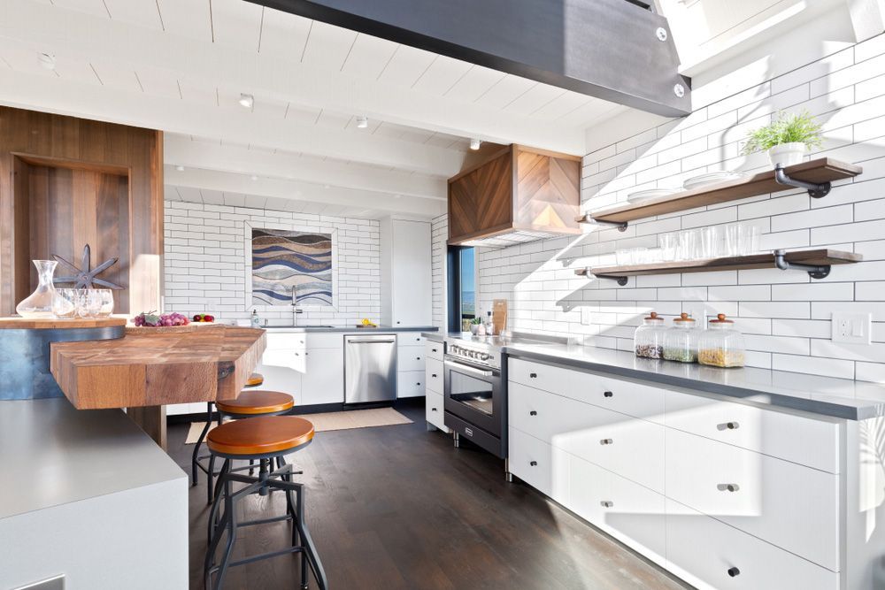 A Kitchen with White Cabinets and A Wooden Counter Top — Rodney Lees Cabinetmaking In Evans Head, NSW