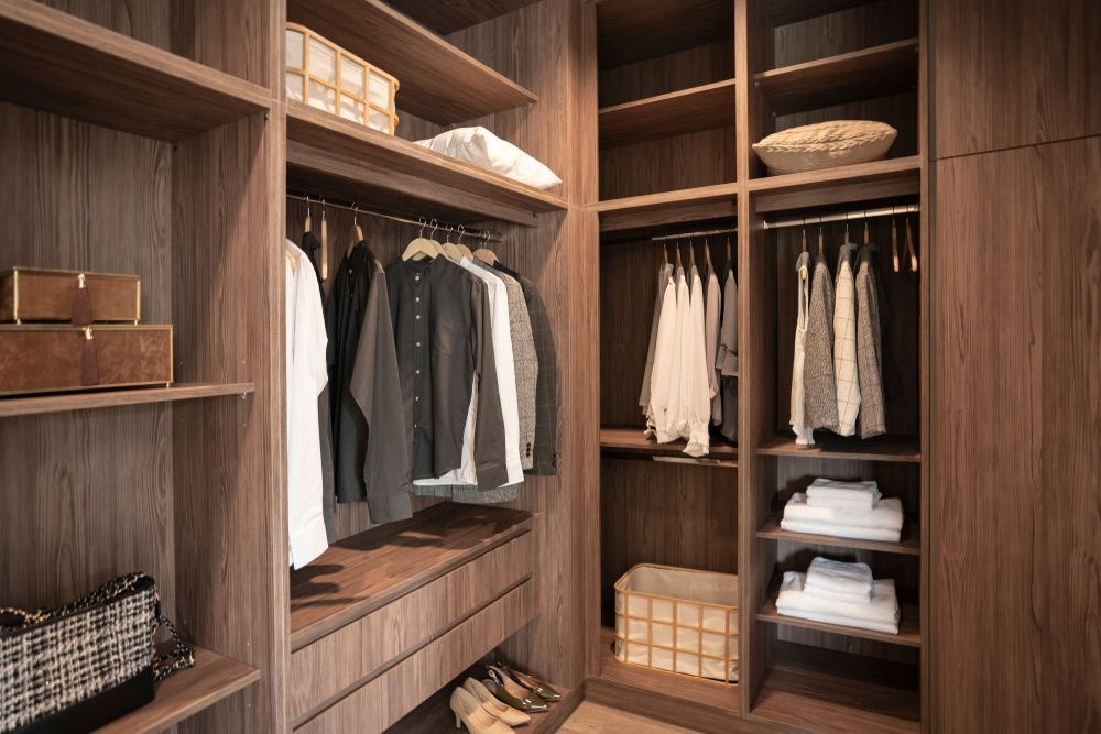 A Walk in Closet Filled with Clothes and Shoes — Rodney Lees Cabinetmaking In Ballina, NSW