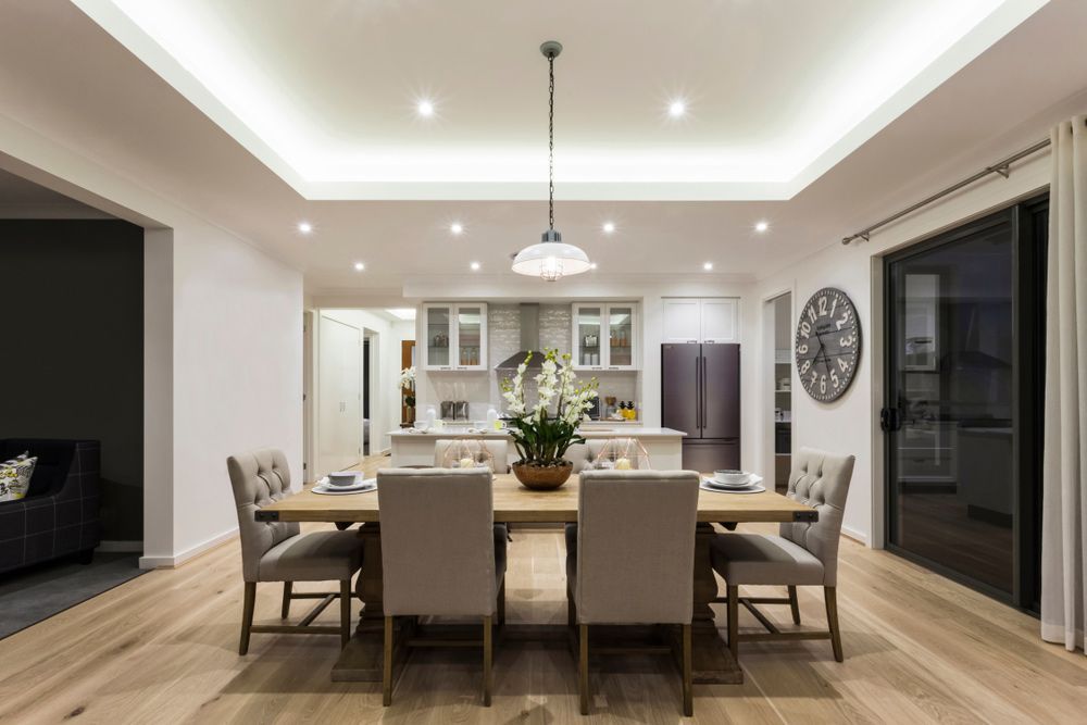 A Dining Room with A Table and Chairs and A Clock on The Wall — Rodney Lees Cabinetmaking In Alstonville, NSW