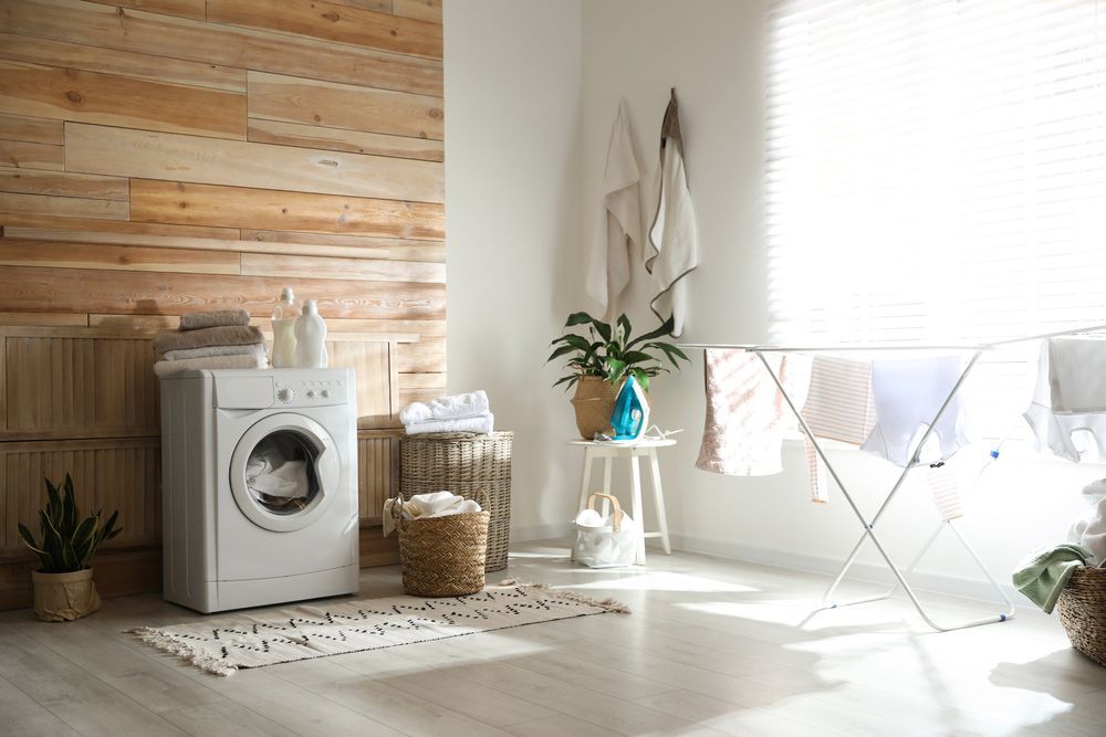 A Laundry Room with A Washing Machine and Drying Rack — Rodney Lees Cabinetmaking In Mullumbimby, NSW