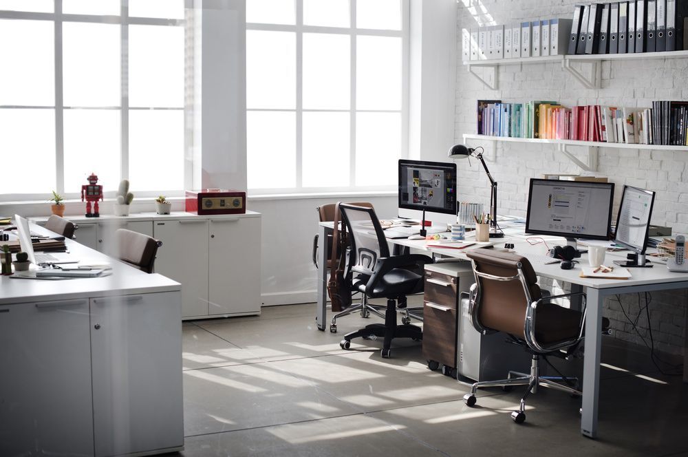 A Row of Desks with Computers and Chairs in An Office — Rodney Lees Cabinetmaking In Ballina, NSW