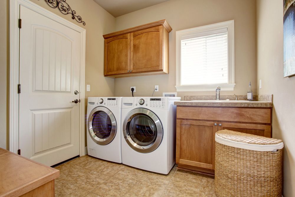 A Laundry Room with A Washer and Dryer and A Sink — Rodney Lees Cabinetmaking In Evans Head, NSW
