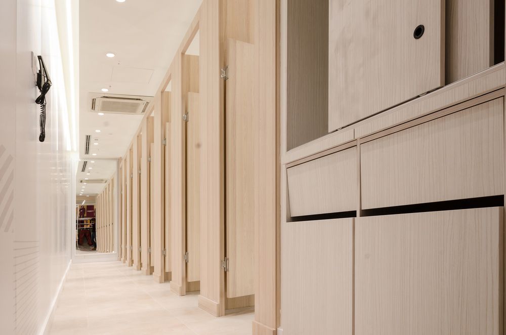 A Long Hallway with A Lot of Lockers and Cabinets — Rodney Lees Cabinetmaking In Mullumbimby, NSW