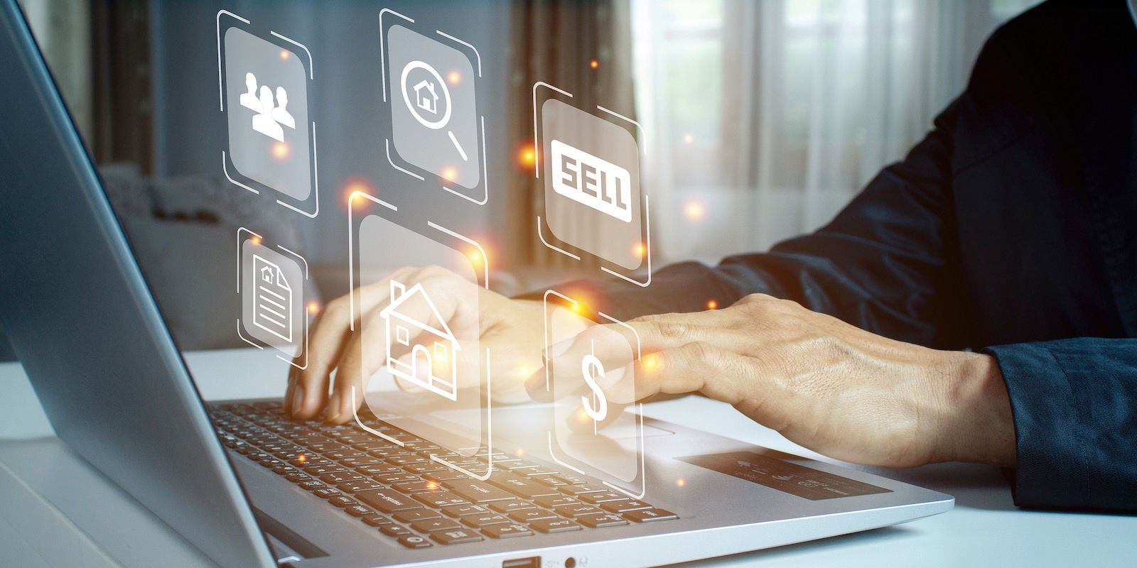 Person using a laptop with digital icons floating above, representing real estate concepts.