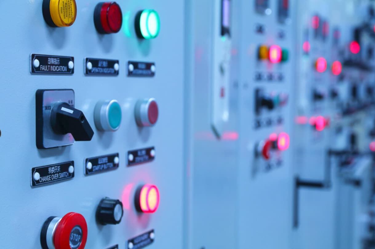 A Row Of Electrical Switches And Lights On A Wall — Mozzlec Electrical & Airconditioning In Urangan, QLD