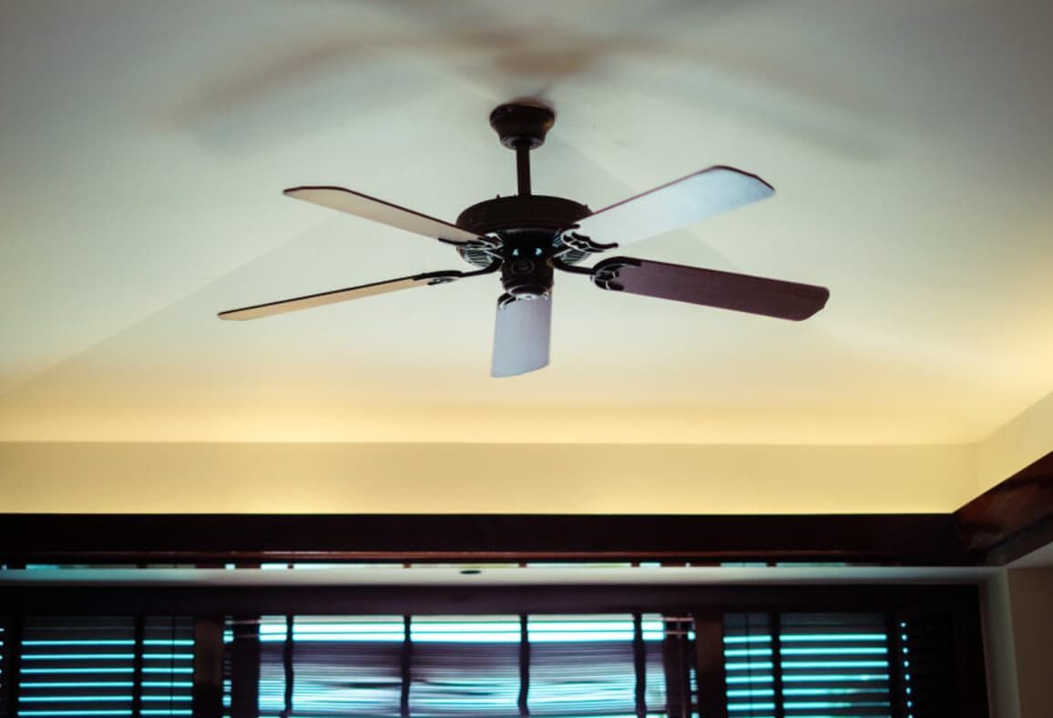 A Ceiling Fan Is Hanging From The Ceiling Of A Room — Mozzlec Electrical & Airconditioning In Urangan, QLD