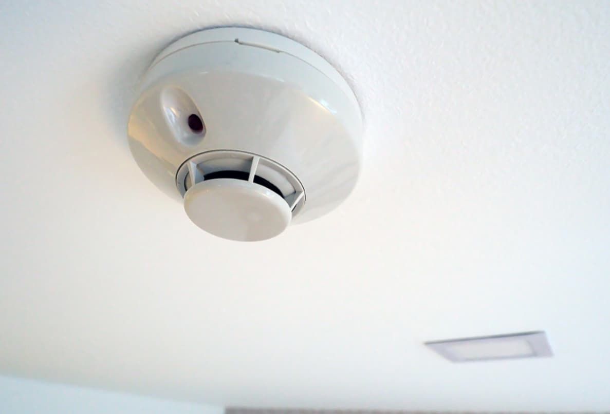 A Smoke Detector Is Mounted To The Ceiling Of A Room — Mozzlec Electrical & Airconditioning In Urangan, QLD