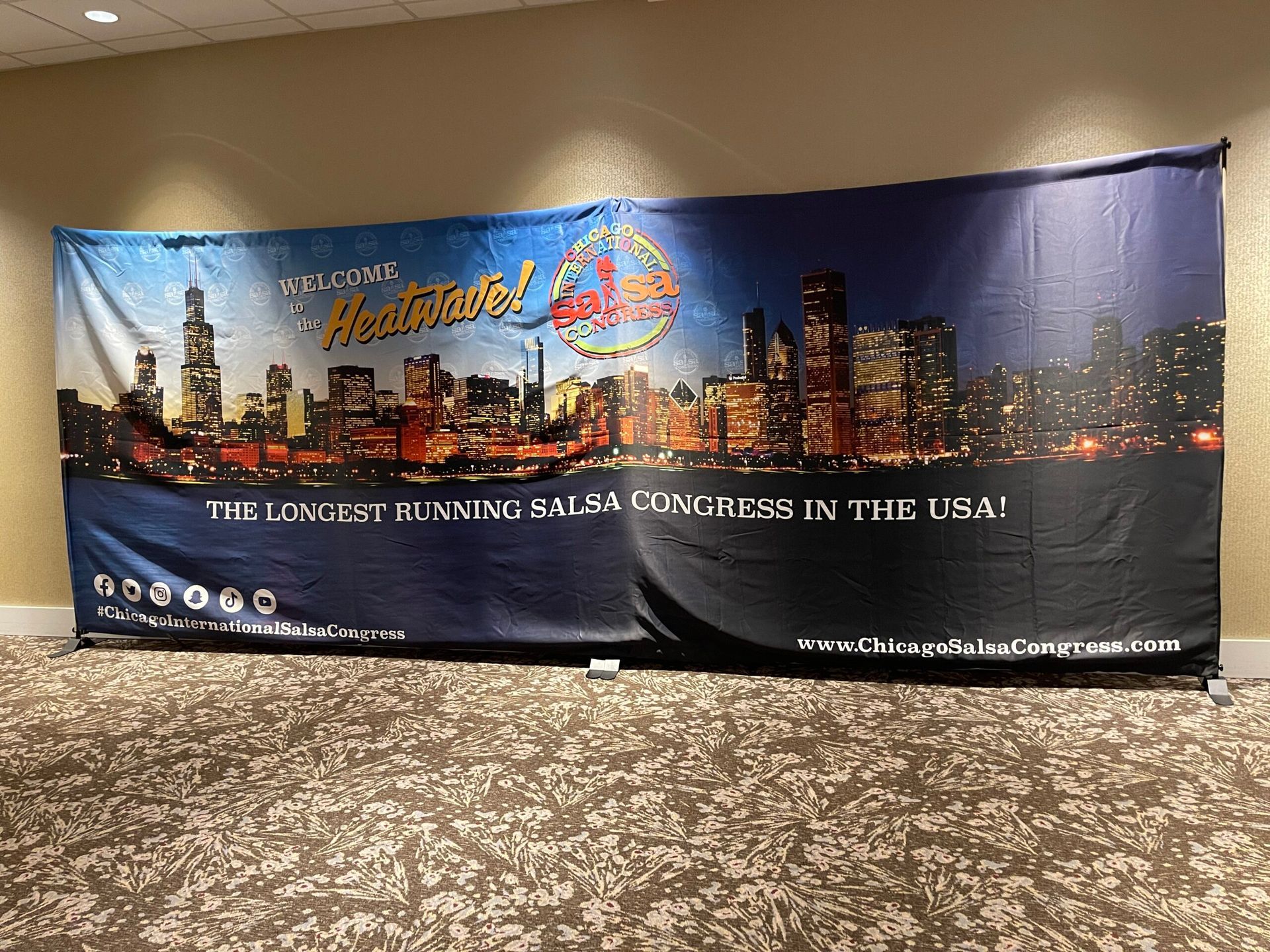 A large banner is hanging on a wall in a room.