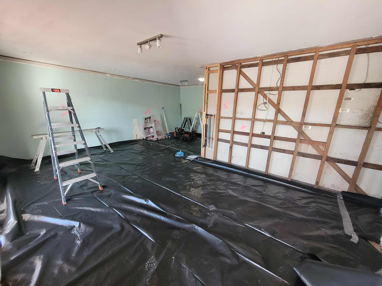 A Room Set Up For Asbestos Removal, With A Ladder In Place — Accredited Asbestos Removers in Ballina, NSW