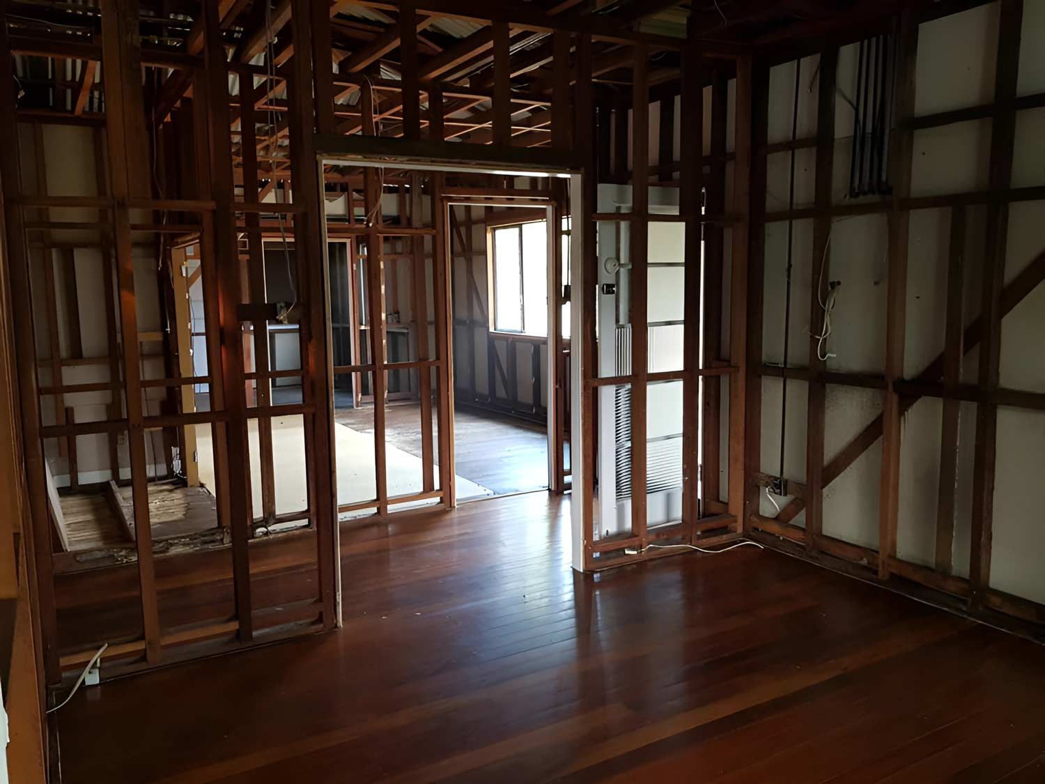 Home With Wooden Walls And A Wooden Floor In A House Under Construction — Accredited Asbestos Removers in Casino, NSW