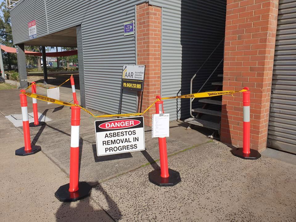 Asbestos Removal Inprogress Sign In Danger — Accredited Asbestos Removers in Casino, NSW 