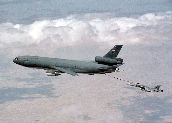 A KC-10 refueling an F/A-18 behind and below it