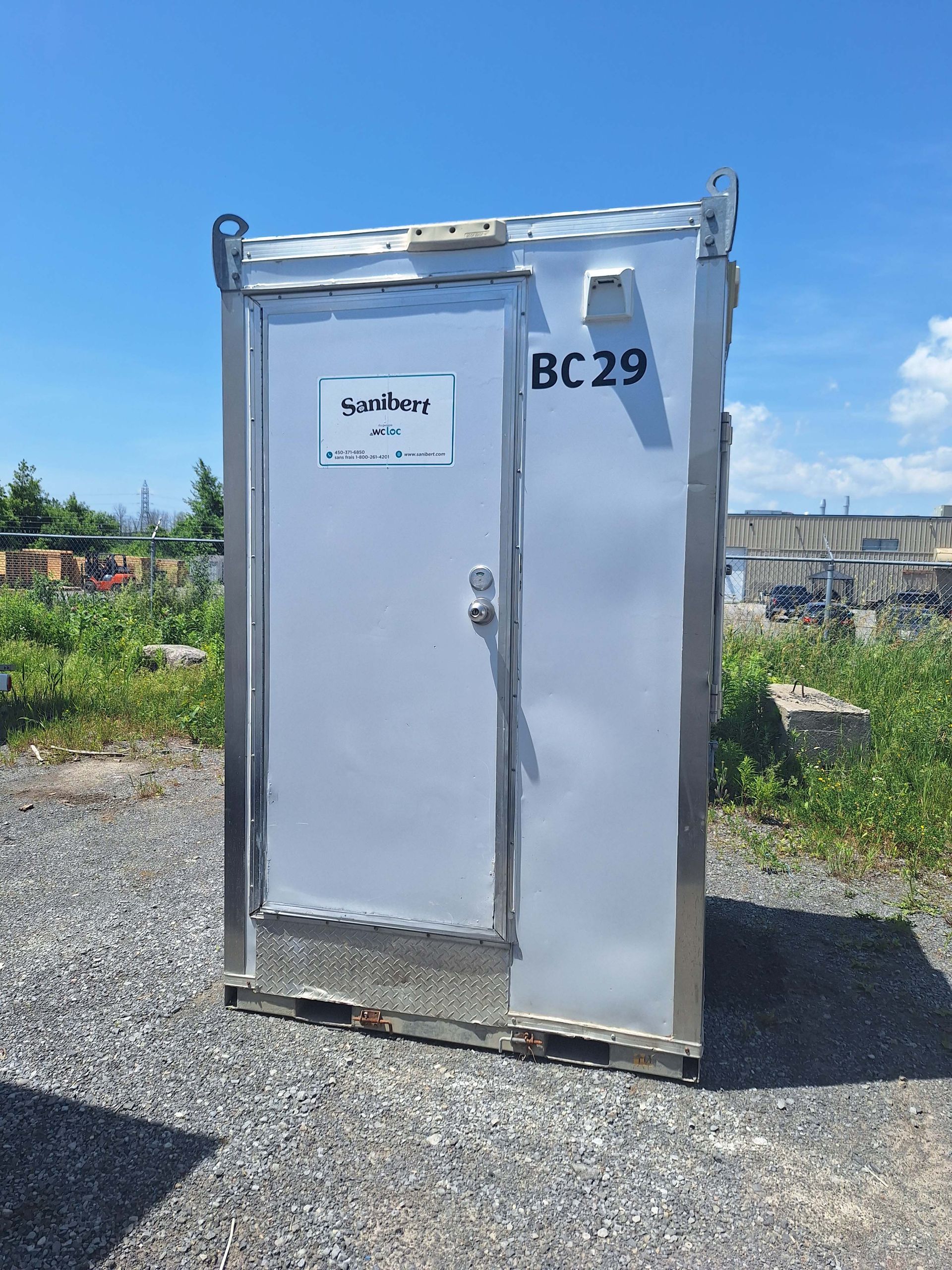 Portable silver metal outdoor restroom with