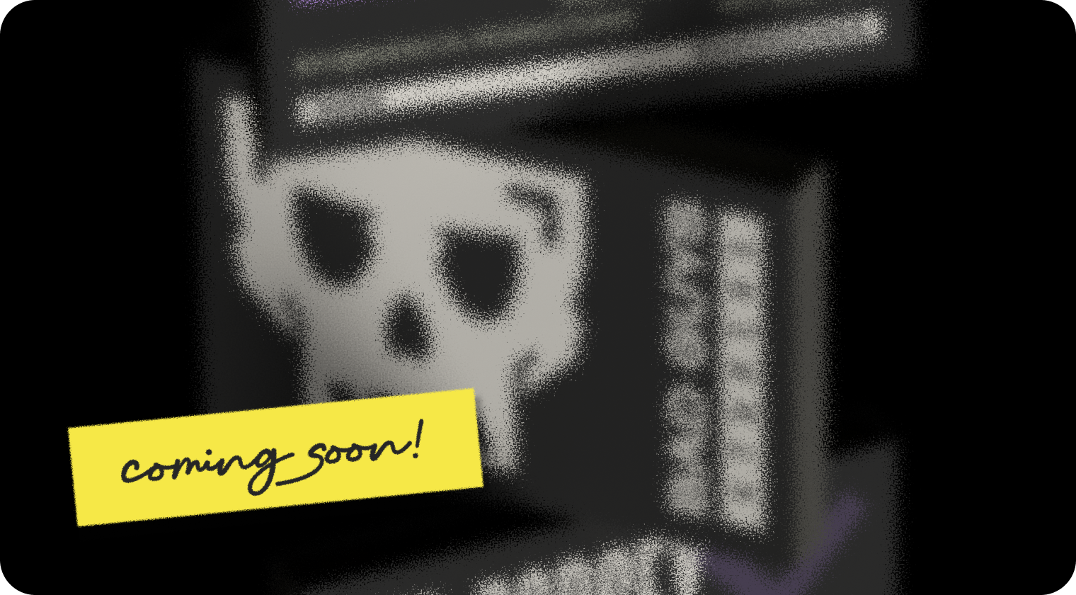Pile of blurred black cards with a skull and 