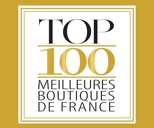 Logo or et blanc : « TOP 100 MEILLEURES BOUTIQUES DE FRANCE ».