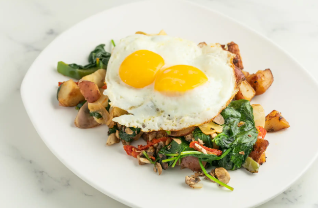 bacon and eggs with hash browns and spinach