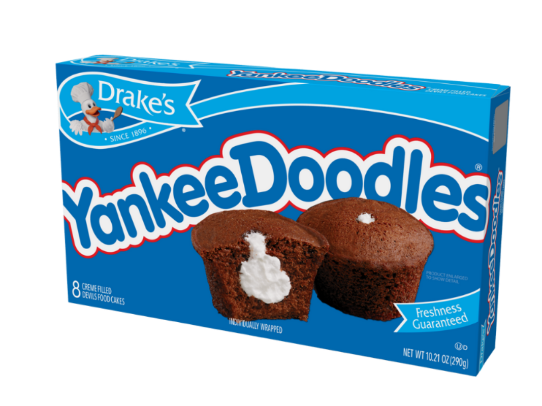 A blue box of Drake's Yankee Doodles cupcakes, showing two chocolate cupcakes with white creme filling on the front.
