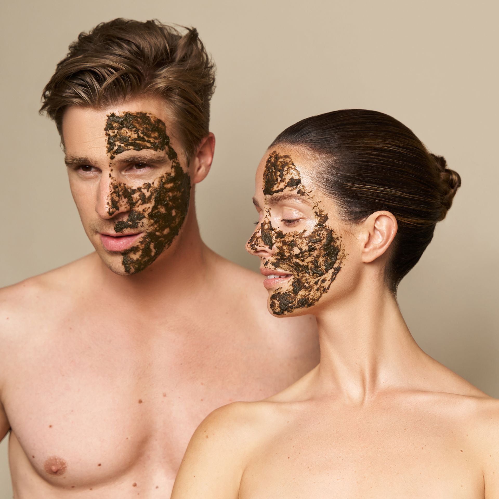 A man and a woman with face masks on their faces