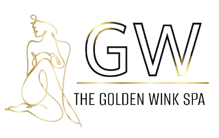 The logo for the golden wink spa shows a woman 's eyes with long eyelashes.