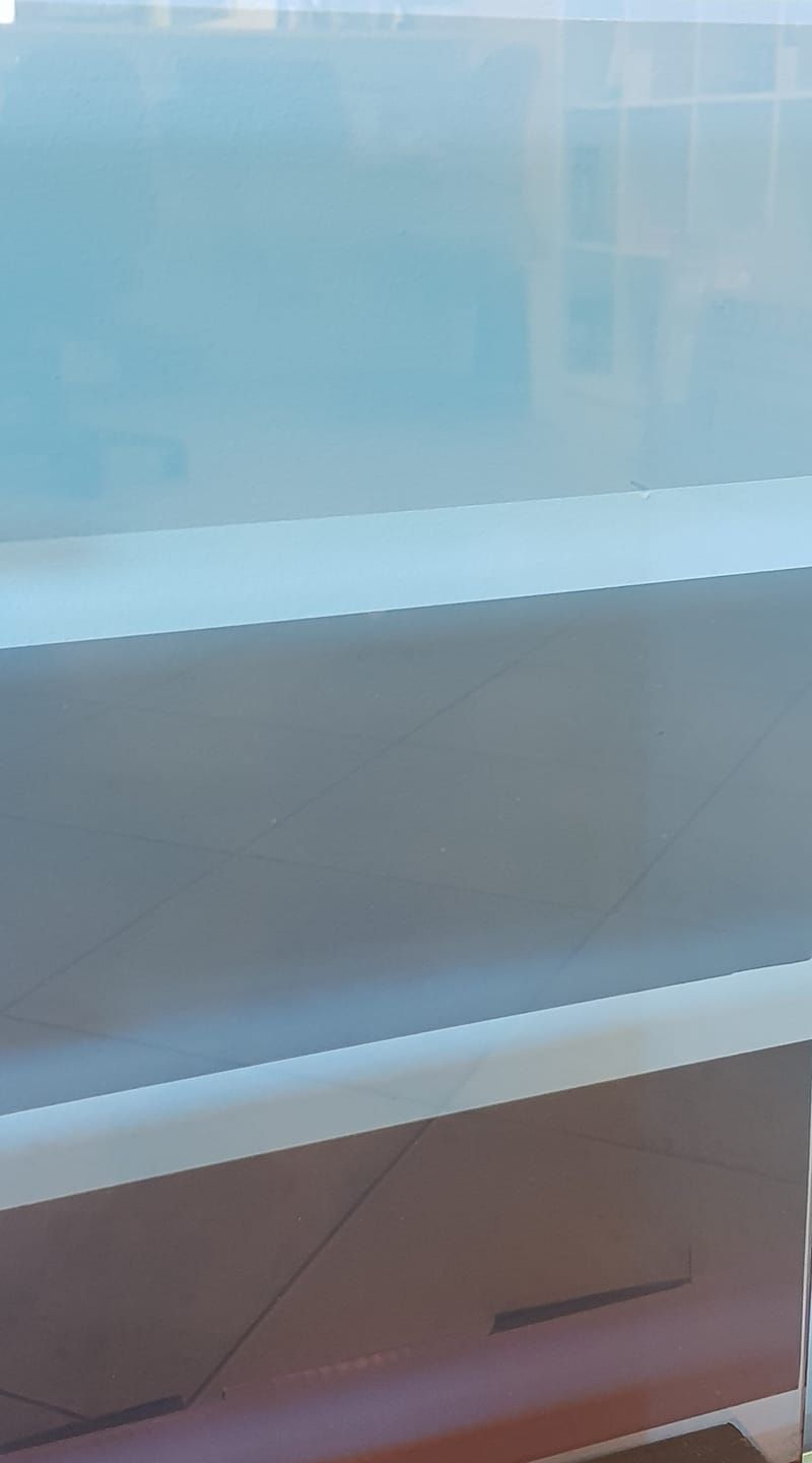 A Clear Plastic Container is Sitting on a Table — Trusty Glass In Alice Springs, NT