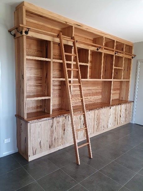 A Room With a Fireplace and a Wooden Cabinet — Envisage Furniture in Kialla, VIC