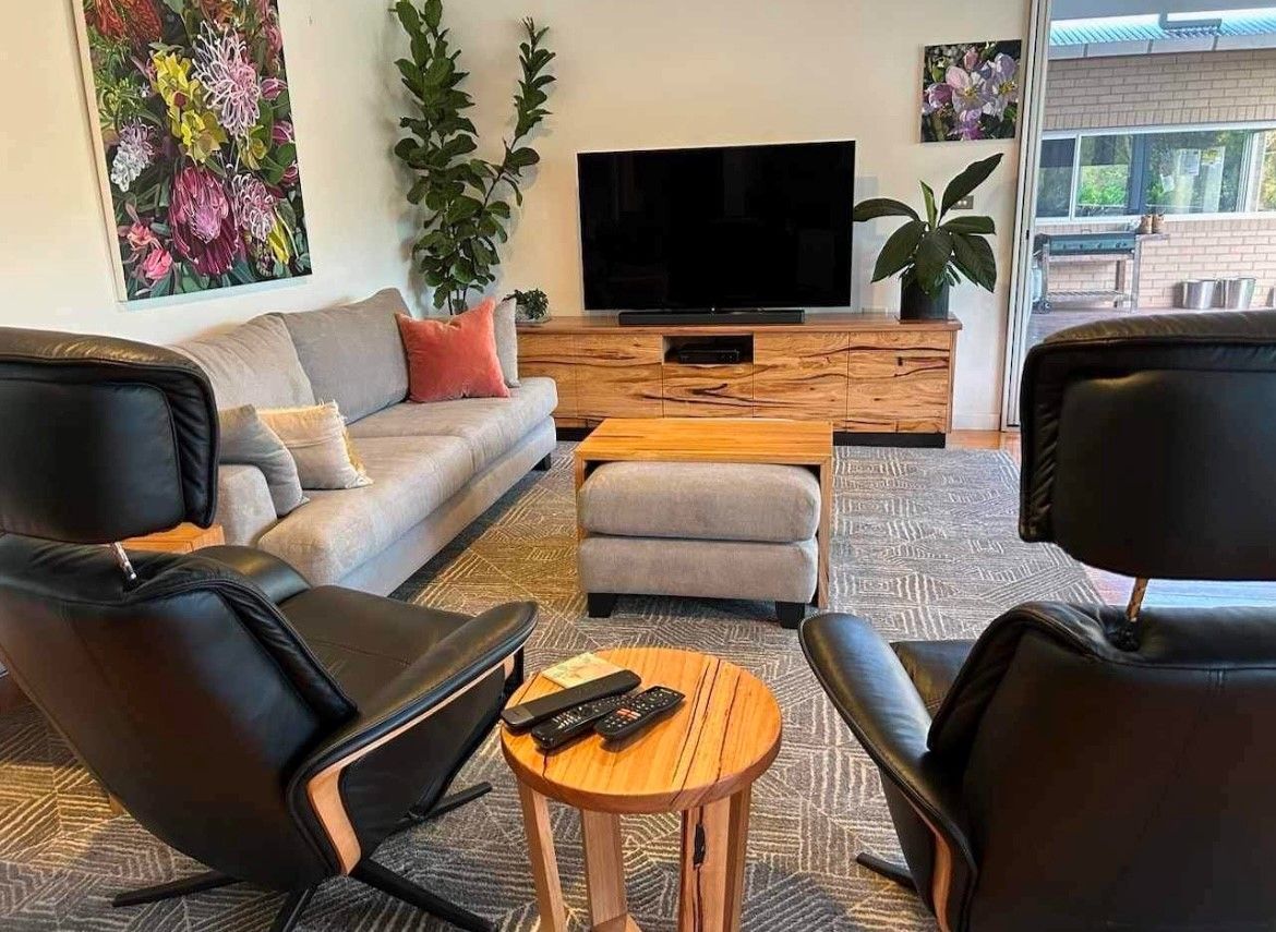 A living room filled with furniture and a flat screen tv.— Envisage Furniture in Kialla, VIC