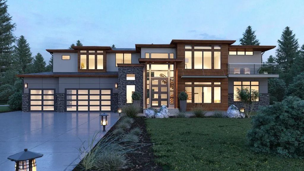 A large house with a lot of windows is surrounded by trees