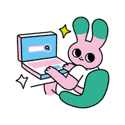 Pink cartoon bunny typing on a laptop, with sparkles and a green chair