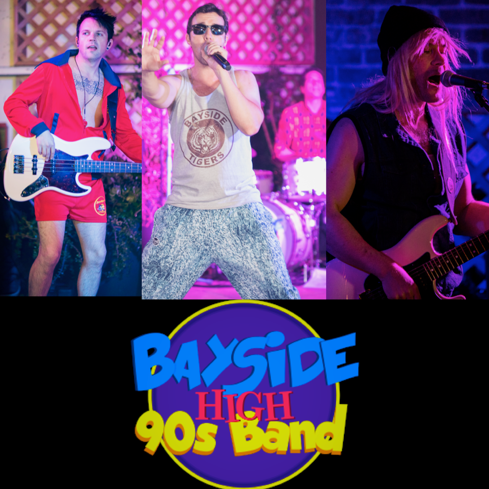Three band members perform on stage, with a 