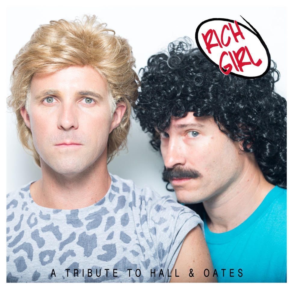Two men in wigs and eighties-style shirts pose for a Hall & Oates tribute album cover with the text 
