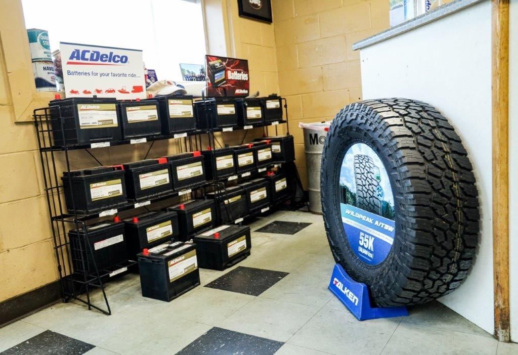 a display of acdelco batteries and a falken tire