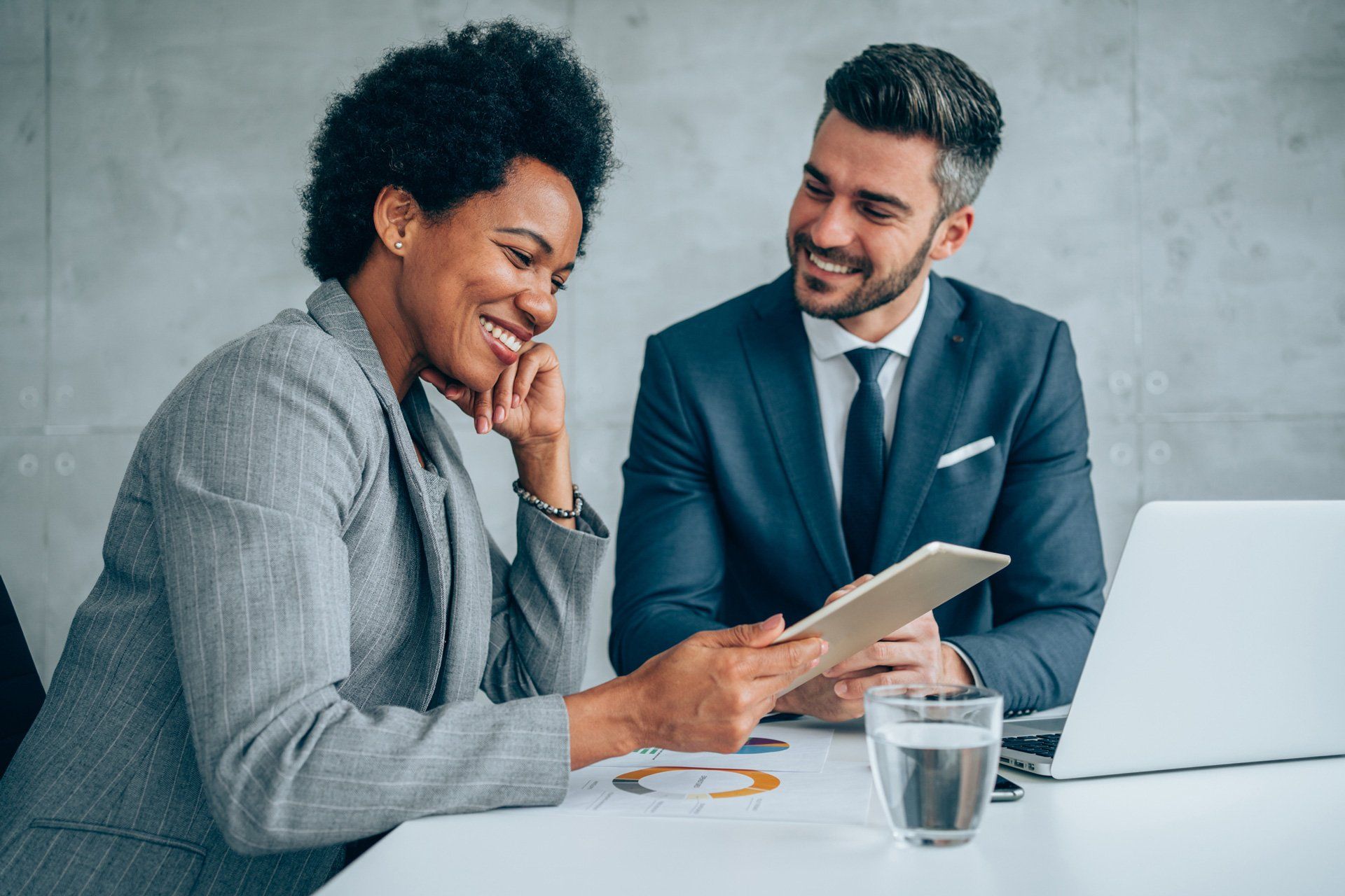 Two people discussing in the front of a tablet | Melbourne, VIC | Menzies Advisory