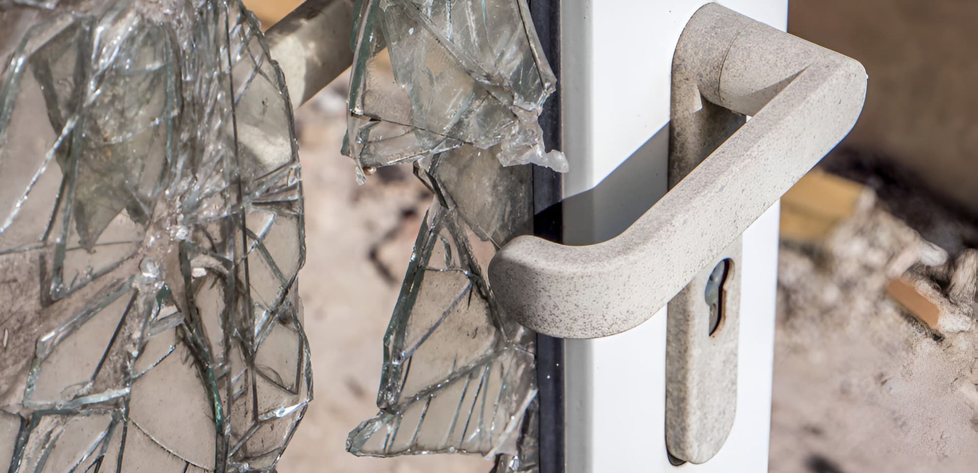 A Close Up Of A Broken Glass Door — Cairns Criminal Lawyers In Cairns City, QLD