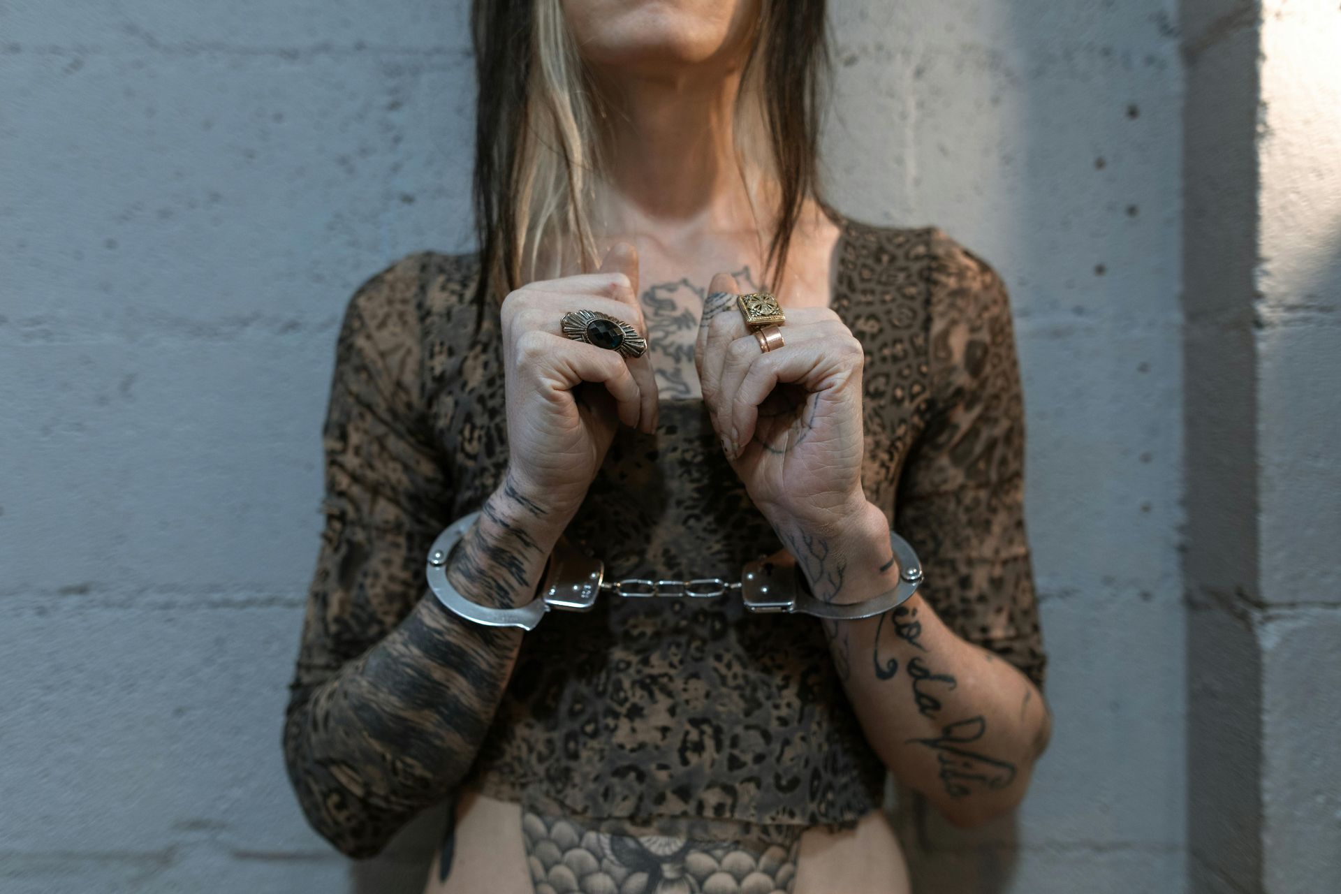 Woman in Handcuffs — Cairns Criminal Lawyers In Redlynch, QLD