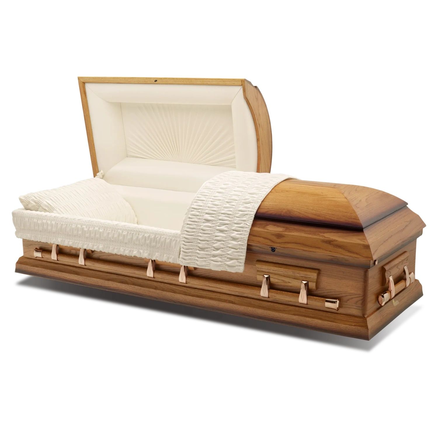 Open wooden casket with white interior lining and a cream blanket draped over it