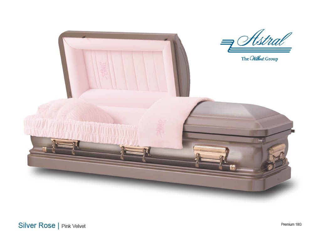 Open vintage casket styled as a pink upholstered sofa with matching cushion