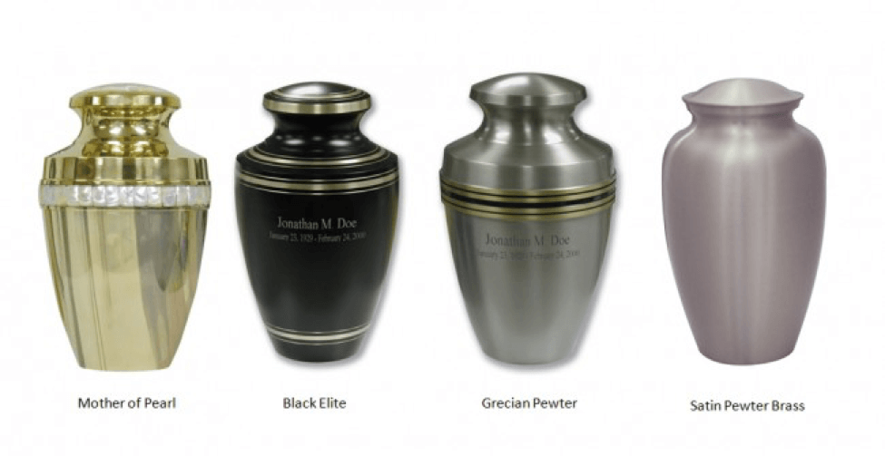 Four decorative funeral urns in metallic gold, black, silver, and pink on a white background