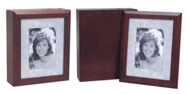 Two dark wood photo frames, one open showing a black-and-white portrait inside.