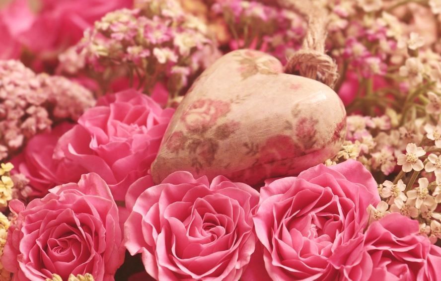 Heart keepsake among pink roses, honoring with care ideas, funeral homes Kathleen, GA