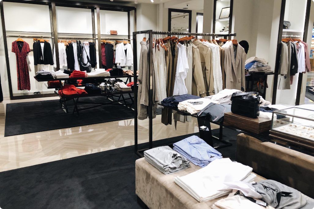 A clothing store with a lot of clothes on display