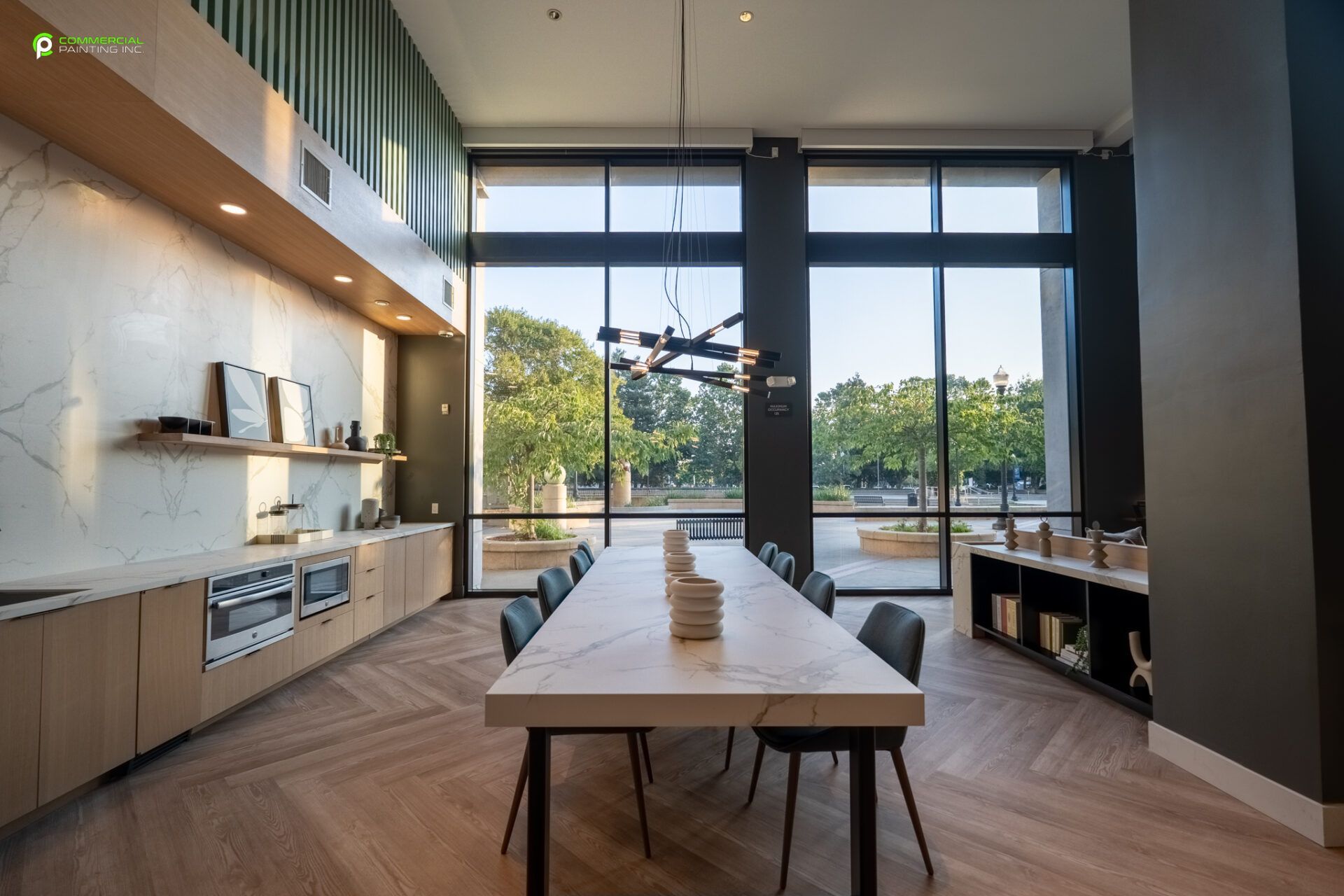 There is a long table in the middle of the room.
