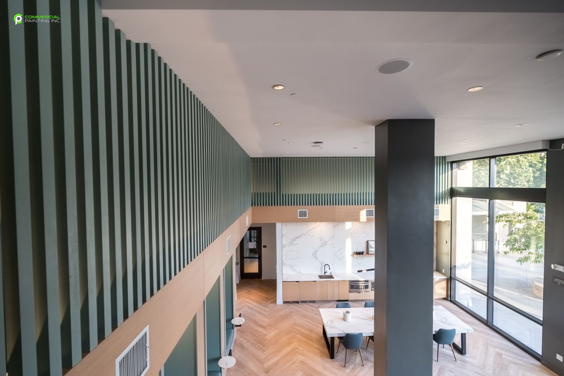 A large room with a lot of windows and a striped wall