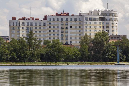 A large building is visible over a body of water