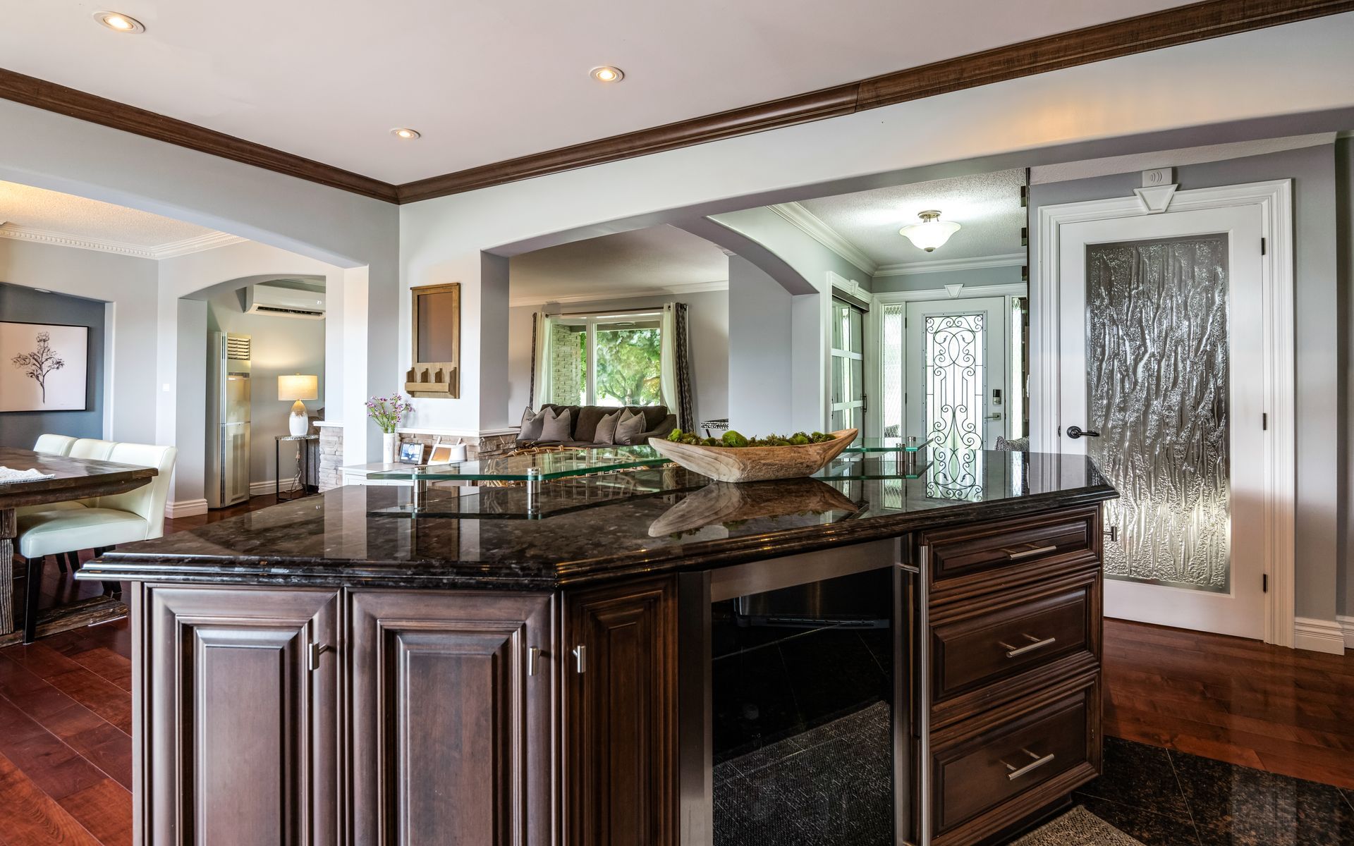 There is a large island in the middle of the kitchen.