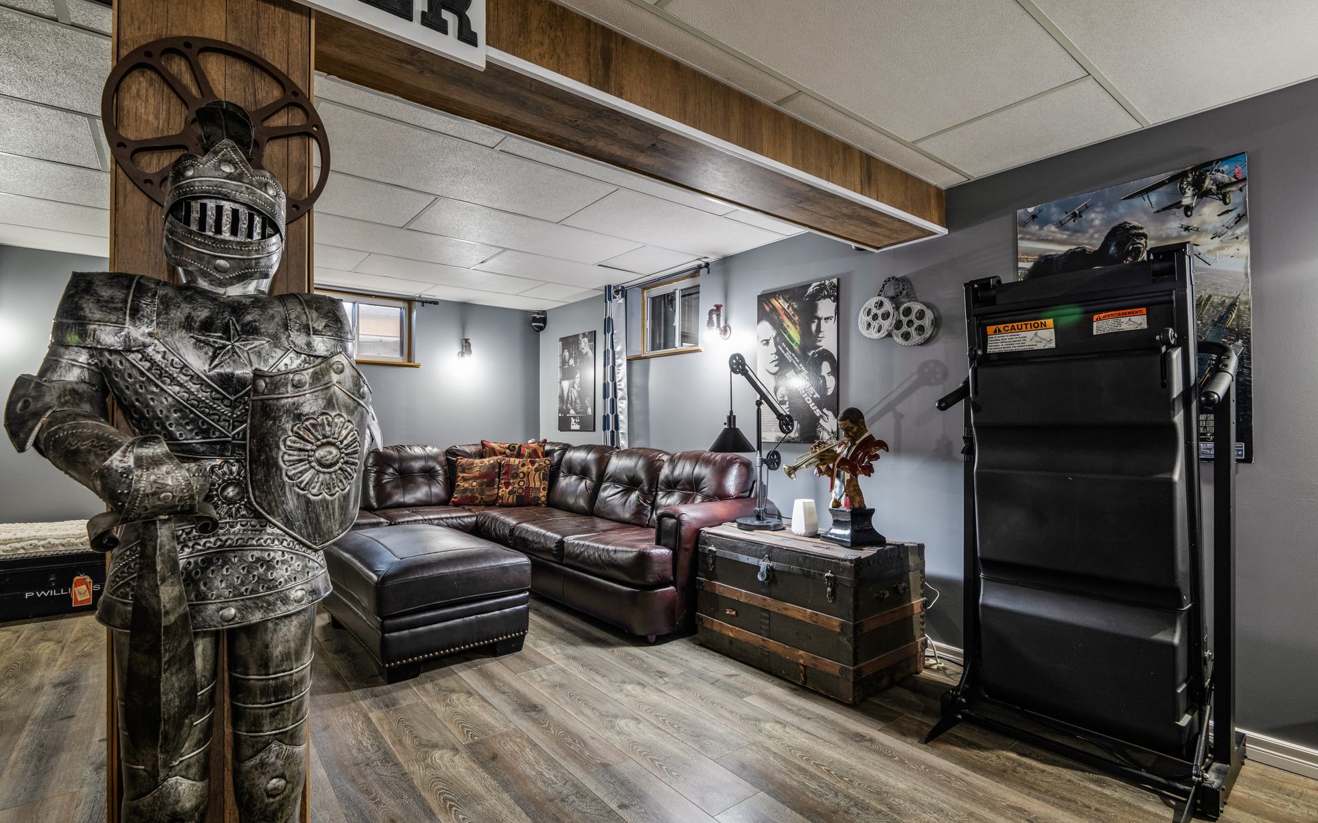 A living room with a statue of a knight and a couch.