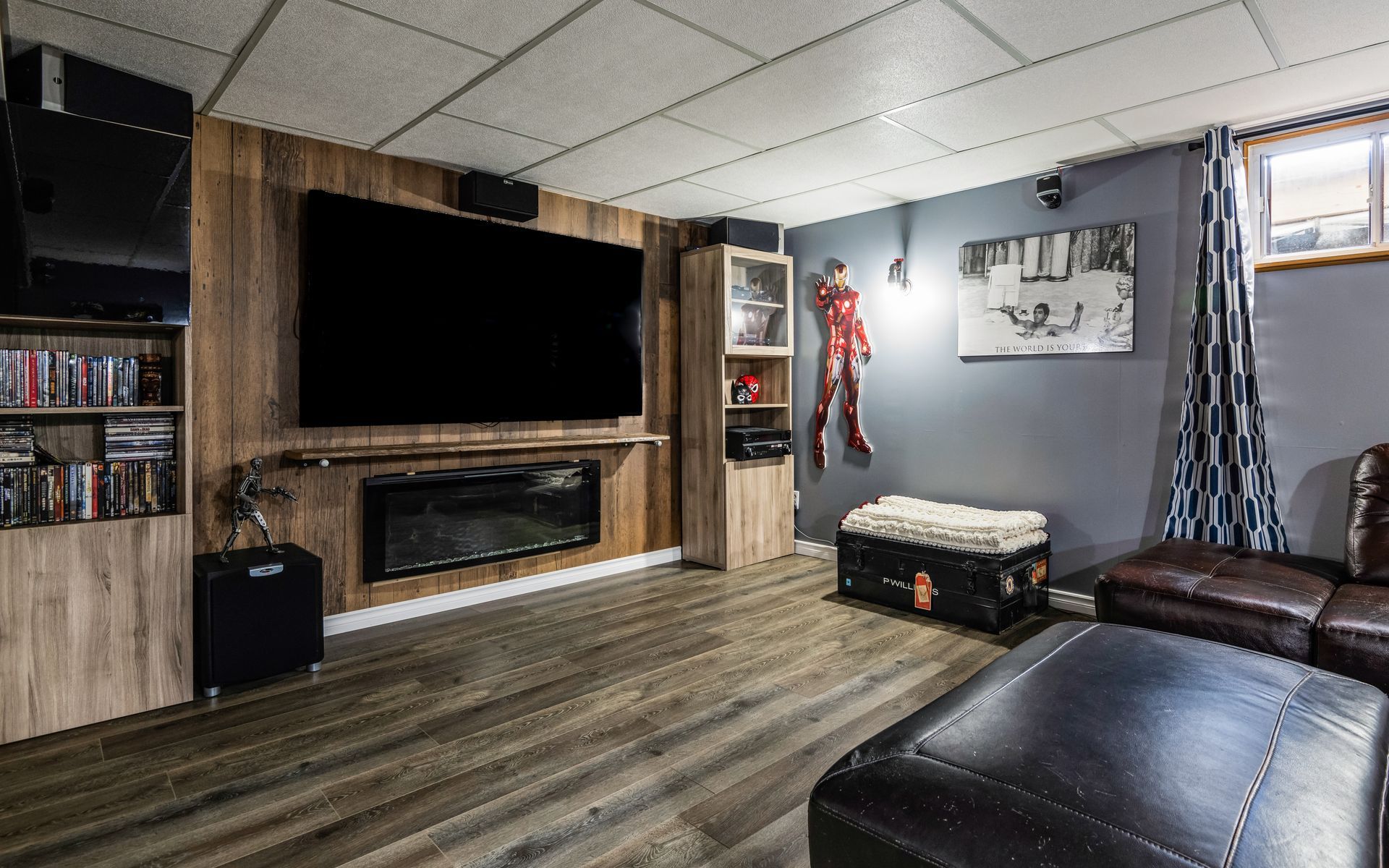 A living room with a flat screen tv and a fireplace.