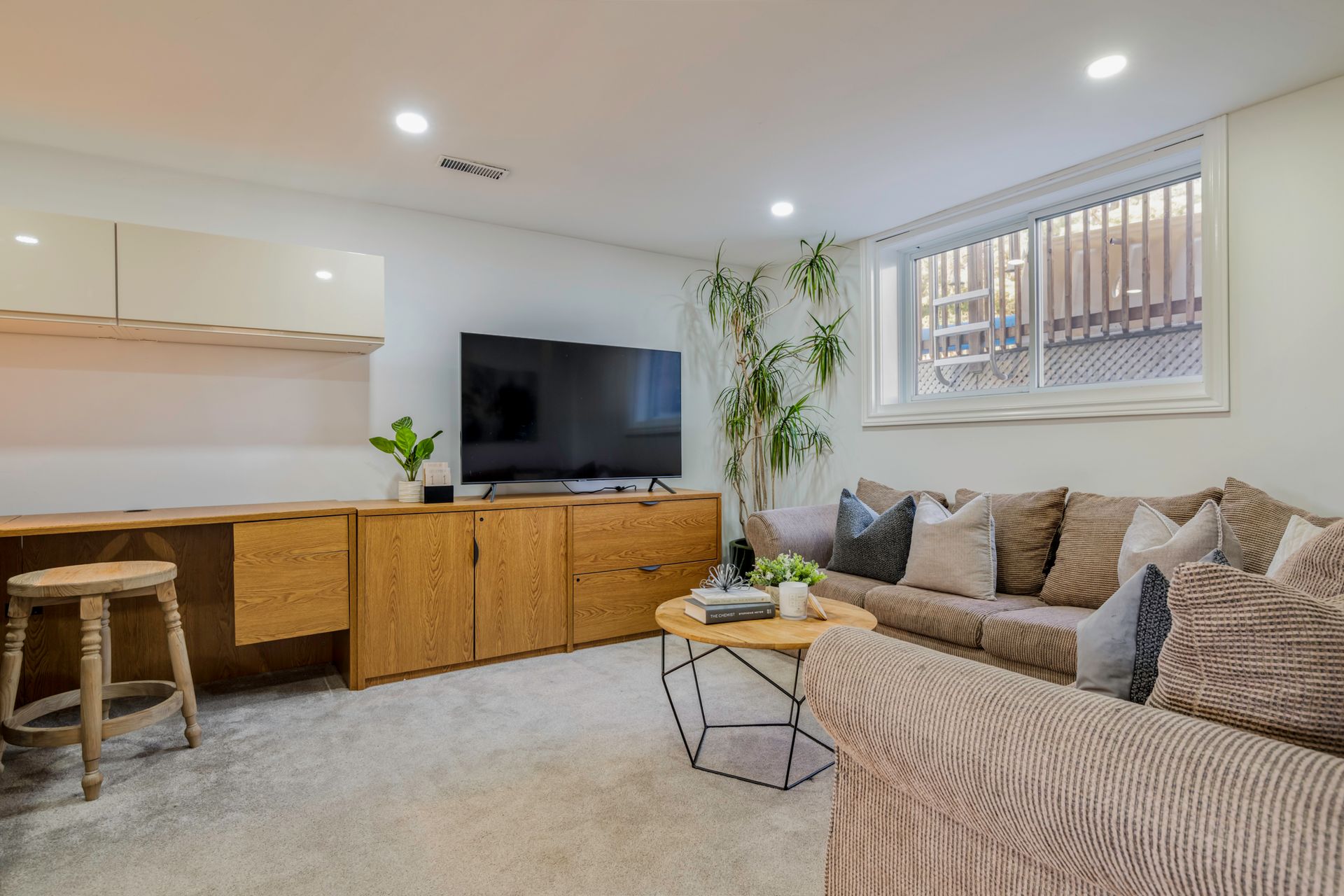 A living room filled with furniture and a flat screen tv.